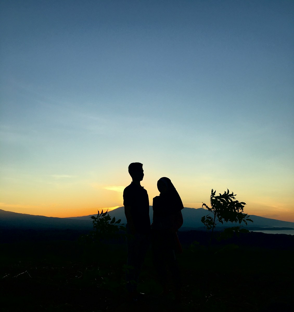 a man and a woman standing next to each other